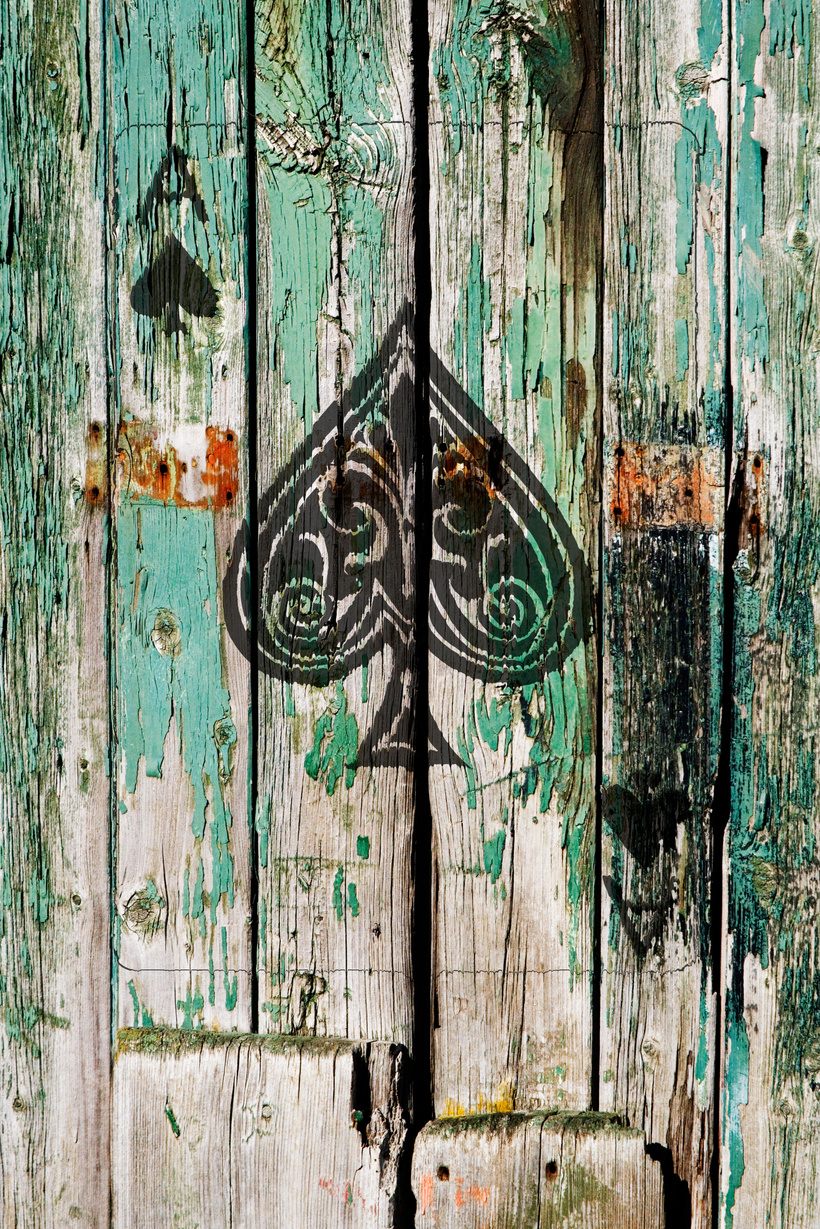 Ace of Spades on old wooden door